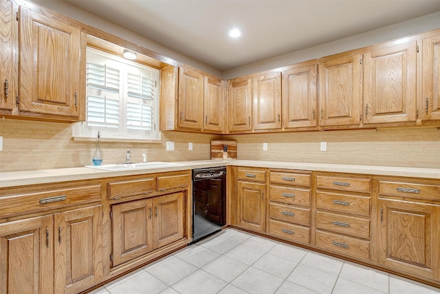 1103 Dirkson St, Weatherford, TX 76086 - kitchen featuring a sink, black dishwasher, light countertops, and light tile patterned floors
