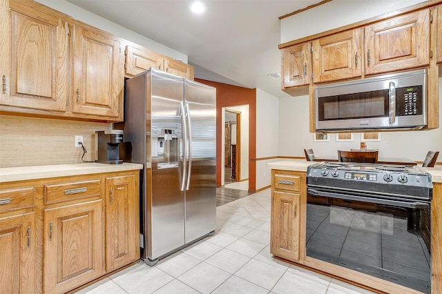 1103 Dirkson St, Weatherford, TX 76086 - kitchen featuring appliances with stainless steel finishes, light countertops, and light tile patterned floors