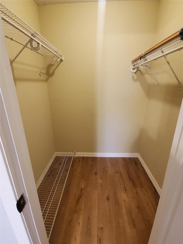12480 Abrams Rd, Dallas, TX 75243 - walk in closet with wood finished floors