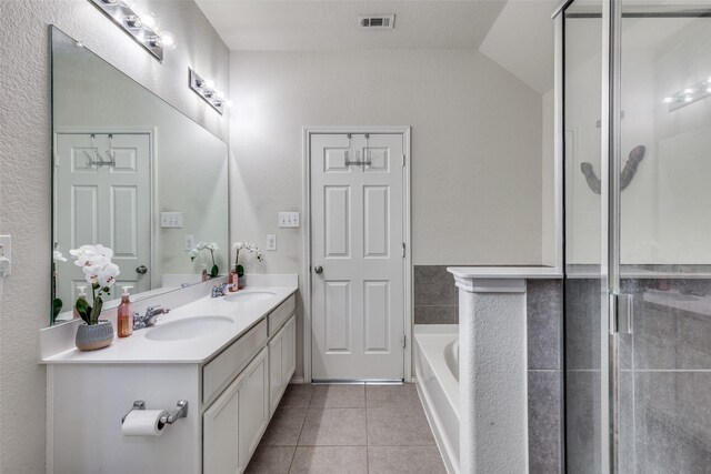 7828 Tudanca Trl, Fort Worth, TX 76131 - full bath featuring tile patterned flooring, double vanity, a bath, vaulted ceiling, and a shower with shower door