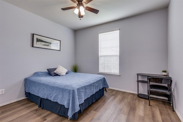 7828 Tudanca Trl, Fort Worth, TX 76131 - bedroom featuring multiple windows, wood finished floors, and baseboards