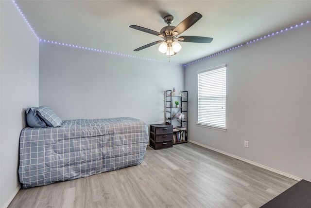 7828 Tudanca Trl, Fort Worth, TX 76131 - bedroom with wood finished floors, baseboards, and a ceiling fan