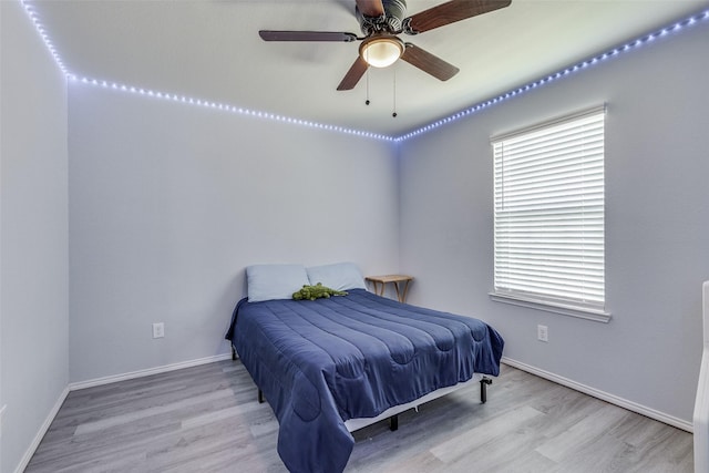 7828 Tudanca Trl, Fort Worth, TX 76131 - bedroom with wood finished floors, multiple windows, and baseboards