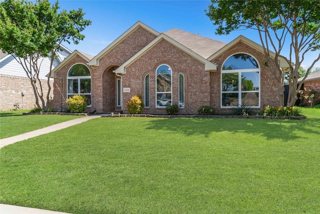 11505 Canoe Rd, Frisco, TX 75035 - ranch-style house with a front lawn and brick siding