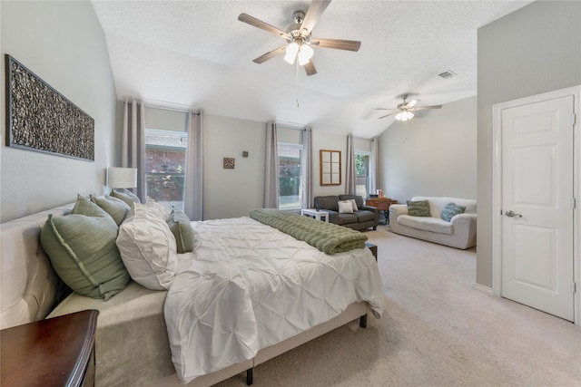 11505 Canoe Rd, Frisco, TX 75035 - bedroom with vaulted ceiling, a textured ceiling, light colored carpet, and ceiling fan