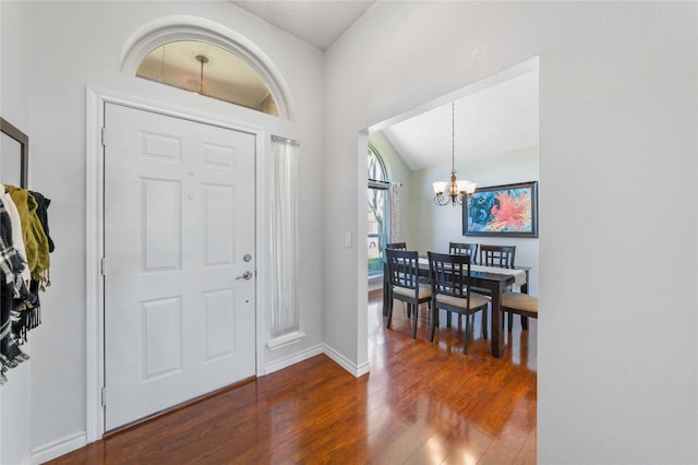 11505 Canoe Rd, Frisco, TX 75035 - entryway with a chandelier, dark wood-style floors, baseboards, and lofted ceiling