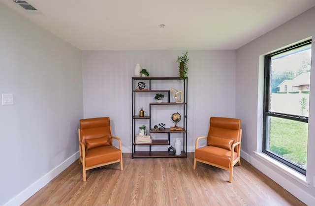 6519 Club Wood, Dallas, TX 75237 - sitting room with light wood-type flooring, plenty of natural light, and baseboards
