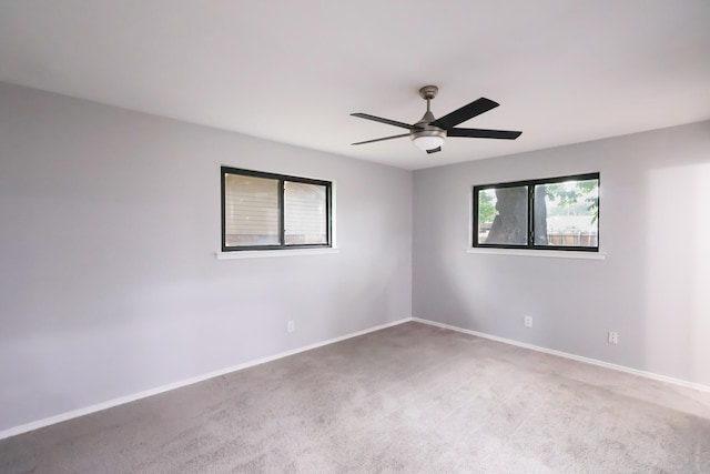 6519 Club Wood, Dallas, TX 75237 - spare room featuring carpet floors, baseboards, and a ceiling fan