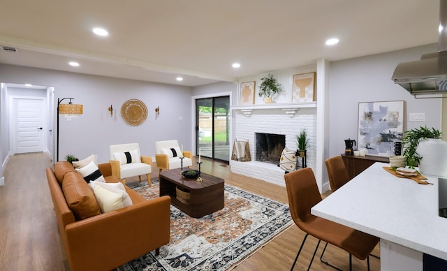 6519 Club Wood, Dallas, TX 75237 - living room with recessed lighting, wood finished floors, and a brick fireplace