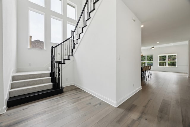 3705 Melville Cir, Flower Mound, TX 75022 - stairs with wood finished floors, a ceiling fan, baseboards, and recessed lighting
