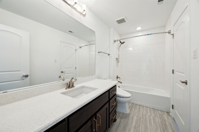 3705 Melville Cir, Flower Mound, TX 75022 - bathroom with vanity, toilet, shower / bathtub combination, wood finished floors, and recessed lighting