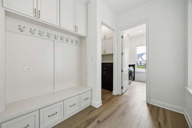 3705 Melville Cir, Flower Mound, TX 75022 - mudroom with baseboards, light wood-style flooring, and washer and clothes dryer