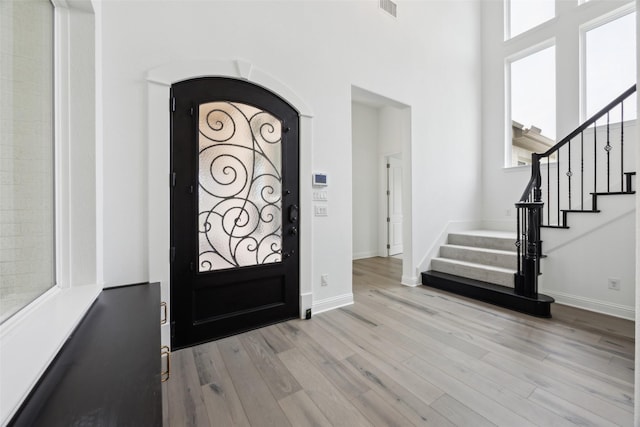 3705 Melville Cir, Flower Mound, TX 75022 - foyer featuring wood finished floors, baseboards, and stairs