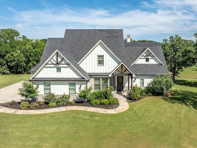 116 Estancia Ct, Decatur, TX 76234 - modern inspired farmhouse featuring board and batten siding, a chimney, a front lawn, and a shingled roof