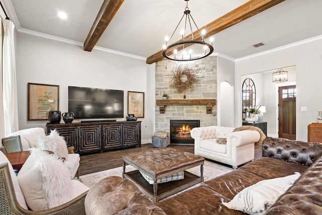 116 Estancia Ct, Decatur, TX 76234 - living area with a chandelier, wood finished floors, a stone fireplace, crown molding, and baseboards