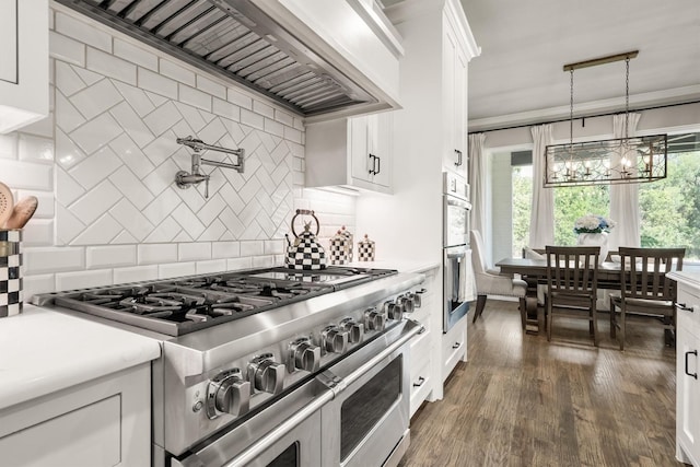 116 Estancia Ct, Decatur, TX 76234 - kitchen featuring stainless steel appliances, custom exhaust hood, light countertops, tasteful backsplash, and ornamental molding