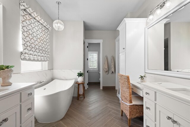 116 Estancia Ct, Decatur, TX 76234 - bathroom featuring vanity, a soaking tub, and a chandelier