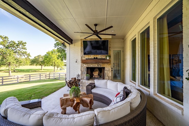 116 Estancia Ct, Decatur, TX 76234 - view of patio with an outdoor living space with a fireplace and a ceiling fan