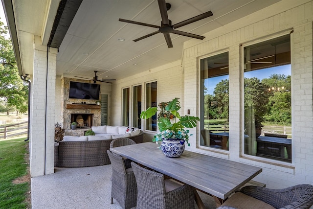 116 Estancia Ct, Decatur, TX 76234 - view of patio with a ceiling fan and an outdoor living space with a fireplace