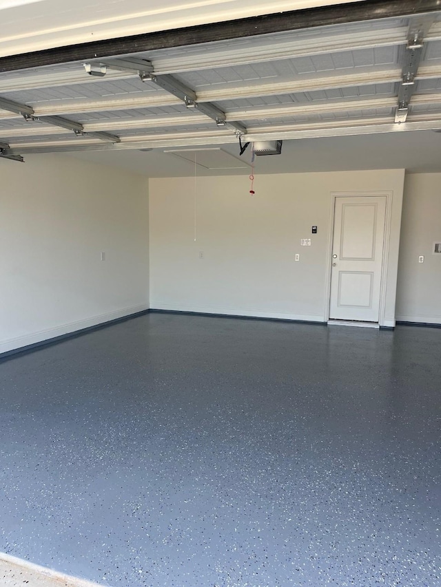 705 Raylan St, Springtown, TX 76082 - garage with a garage door opener and baseboards