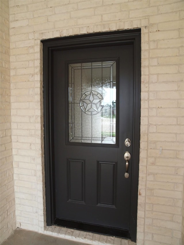 705 Raylan St, Springtown, TX 76082 - property entrance featuring brick siding