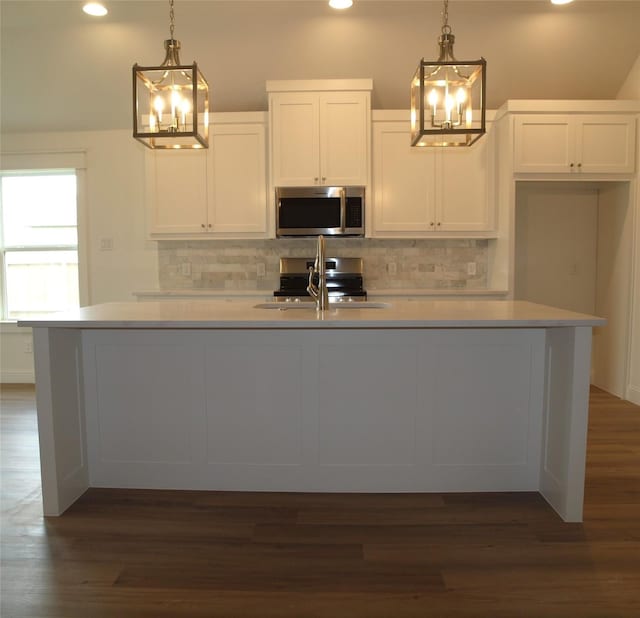 705 Raylan St, Springtown, TX 76082 - kitchen with appliances with stainless steel finishes, a chandelier, decorative backsplash, and recessed lighting