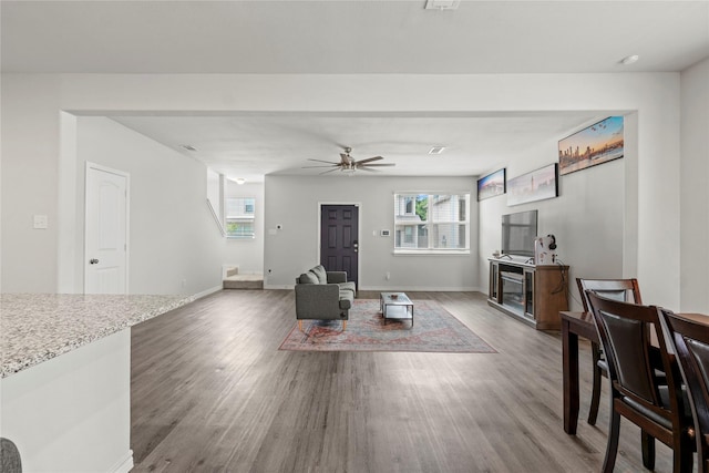 5649 Willamette Dr, Fort Worth, TX 76119 - living area with ceiling fan, wood finished floors, and baseboards