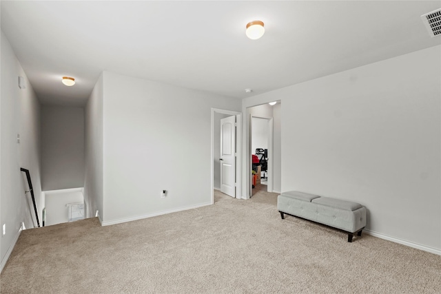 5649 Willamette Dr, Fort Worth, TX 76119 - sitting room with an upstairs landing, light carpet, and baseboards