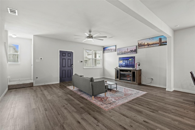 5649 Willamette Dr, Fort Worth, TX 76119 - living area featuring wood finished floors, ceiling fan, and baseboards