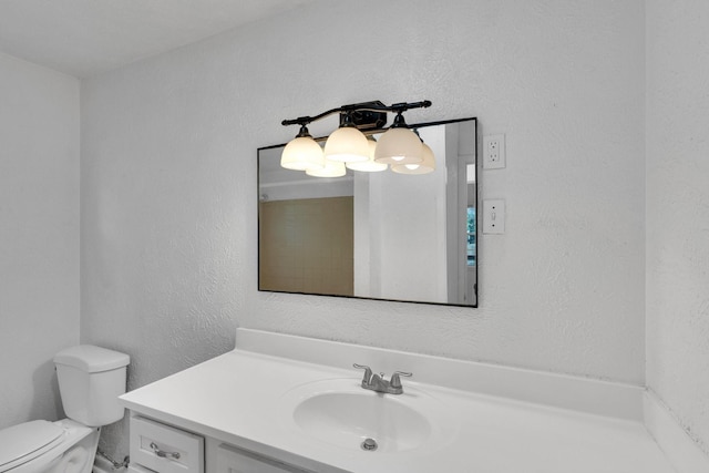 118 Dogwood Trl, Gun Barrel City, TX 75156 - bathroom featuring vanity, toilet, and a textured wall