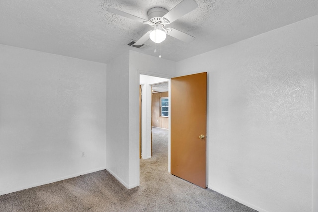 118 Dogwood Trl, Gun Barrel City, TX 75156 - spare room with carpet floors, ceiling fan, a textured ceiling, and baseboards