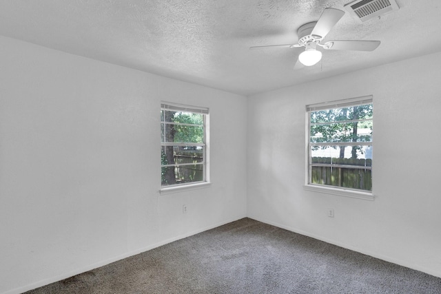 118 Dogwood Trl, Gun Barrel City, TX 75156 - unfurnished room featuring a textured ceiling, carpet flooring, a ceiling fan, and baseboards