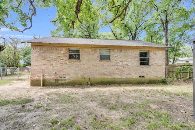 118 Dogwood Trl, Gun Barrel City, TX 75156 - view of home's exterior featuring brick siding, a gate, and crawl space