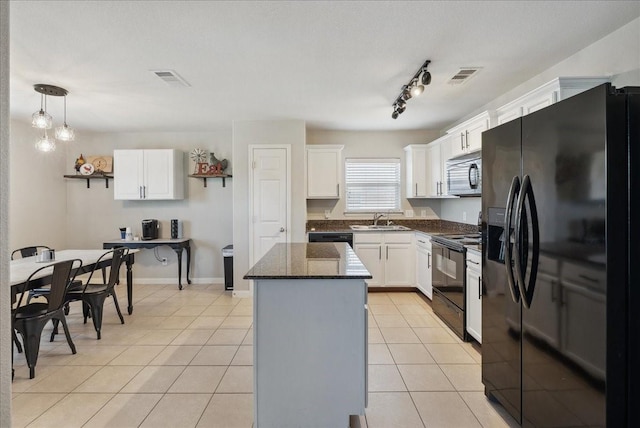 183 Dodge City Trl, Newark, TX 76071 - kitchen featuring black appliances, a sink, a kitchen island, white cabinetry, and light tile patterned floors