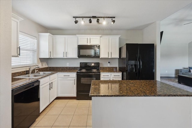 183 Dodge City Trl, Newark, TX 76071 - kitchen featuring black appliances, a sink, white cabinets, light tile patterned floors, and a kitchen island