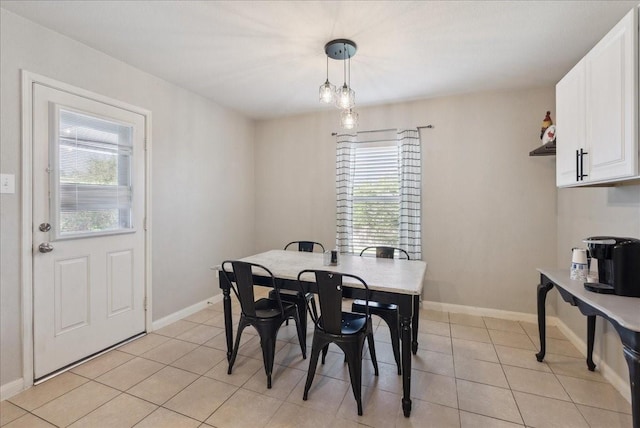 183 Dodge City Trl, Newark, TX 76071 - dining area with healthy amount of natural light, light tile patterned floors, and baseboards