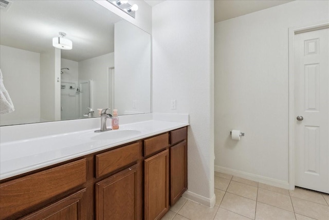 183 Dodge City Trl, Newark, TX 76071 - full bathroom featuring vanity, tile patterned floors, a shower, and baseboards