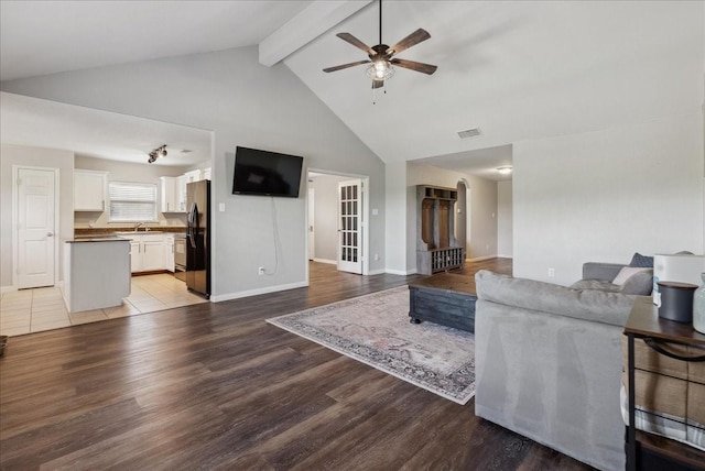 183 Dodge City Trl, Newark, TX 76071 - living room featuring ceiling fan, beamed ceiling, high vaulted ceiling, light wood-style flooring, and baseboards