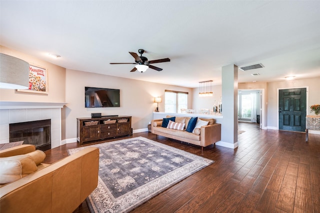 1405 Cardinal Way, Aubrey, TX 76227 - living area featuring a ceiling fan, baseboards, dark wood-style floors, and a tiled fireplace