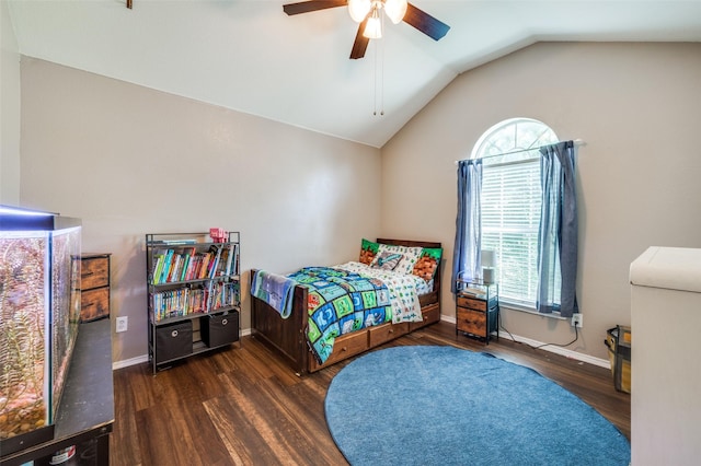 1405 Cardinal Way, Aubrey, TX 76227 - bedroom with multiple windows, wood finished floors, lofted ceiling, ceiling fan, and baseboards