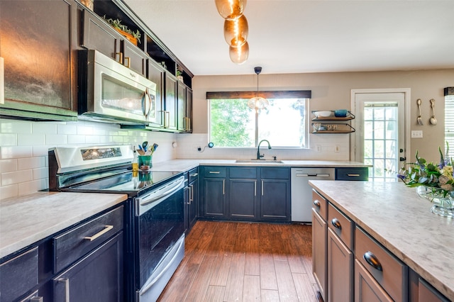 1405 Cardinal Way, Aubrey, TX 76227 - kitchen featuring appliances with stainless steel finishes, open shelves, a sink, and light countertops