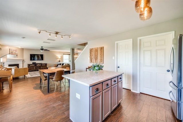 1405 Cardinal Way, Aubrey, TX 76227 - kitchen with open floor plan, dark wood-type flooring, freestanding refrigerator, and ceiling fan