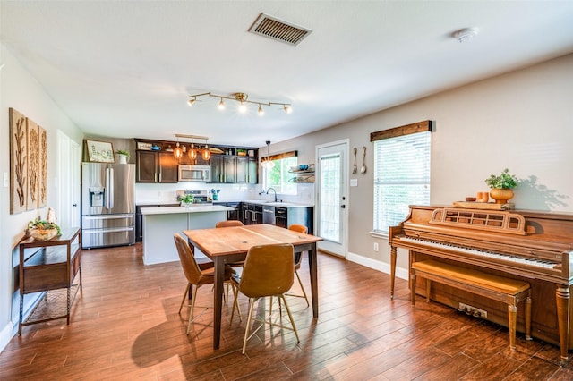 1405 Cardinal Way, Aubrey, TX 76227 - dining area with dark wood finished floors and baseboards
