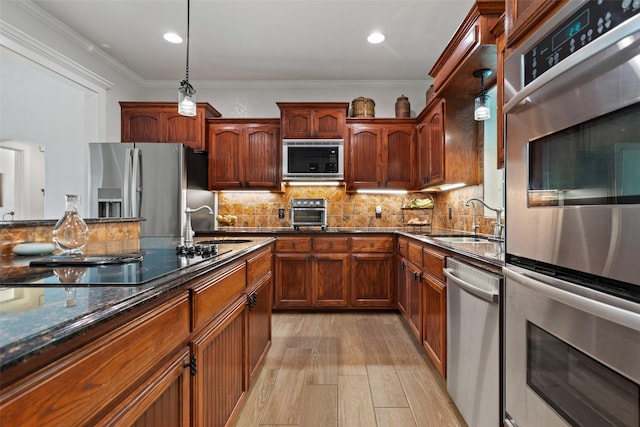 10443 County Road 3407, Brownsboro, TX 75756 - kitchen featuring stainless steel appliances, a sink, light wood-type flooring, dark stone countertops, and ornamental molding