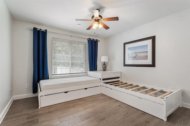 10443 County Road 3407, Brownsboro, TX 75756 - bedroom with wood finished floors, baseboards, and a ceiling fan