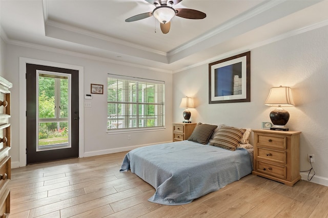 10443 County Road 3407, Brownsboro, TX 75756 - bedroom featuring a raised ceiling, light wood-type flooring, crown molding, and ceiling fan