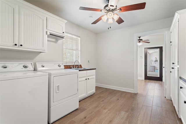 10443 County Road 3407, Brownsboro, TX 75756 - washroom featuring ceiling fan, washing machine and clothes dryer, cabinet space, light wood-style flooring, and baseboards