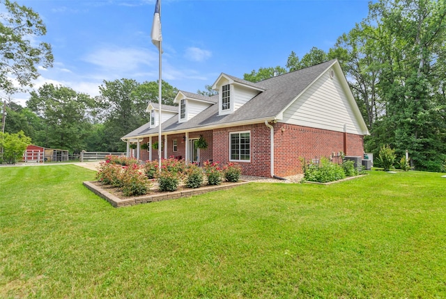 10443 County Road 3407, Brownsboro, TX 75756 - view of side of home with brick siding, a yard, and a shingled roof
