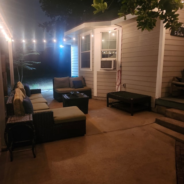 3622 Falls Dr, Dallas, TX 75211 - patio at night featuring a patio, outdoor lounge area, and cooling unit