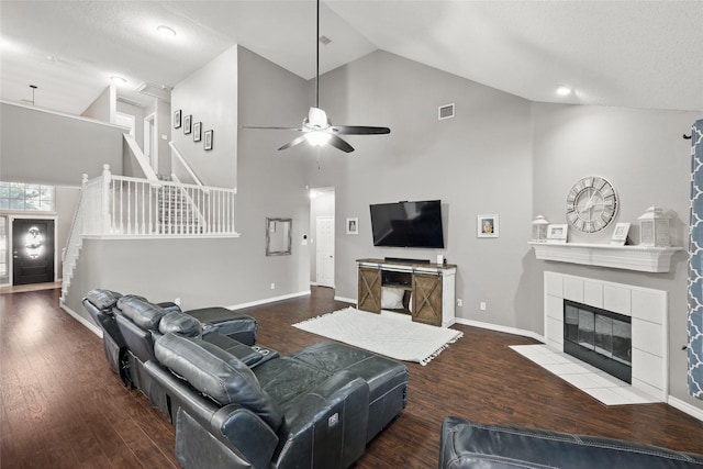 7113 Sundance Ln, Fort Worth, TX 76179 - living room featuring ceiling fan, stairway, high vaulted ceiling, wood finished floors, and a fireplace